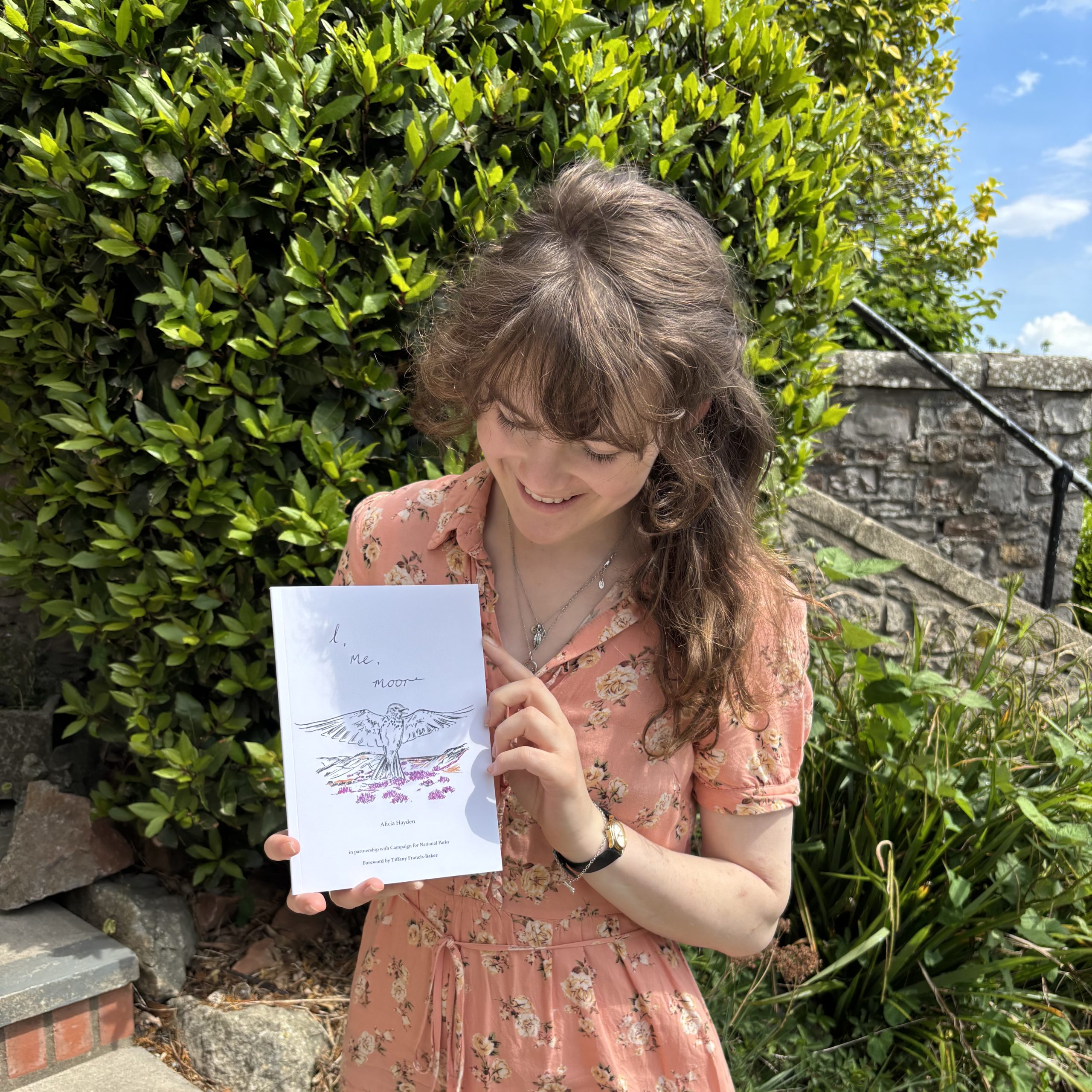 Alicia Hayden with her book I, me, moor
